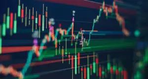 Bitunix A digital screen displaying colorful financial charts and candlestick graphs, indicating fluctuating stock market data, crypto trading trends, and analytics in real time. | Bitunix crypto trading