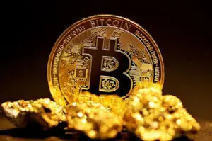 Bitunix A gold-colored Bitcoin coin stands upright behind several small gold nuggets, symbolizing cryptocurrency and digital wealth. The well-lit scene highlights the metallic shine, evoking the anticipation of bitcoin halving events in a dark background.
