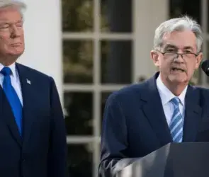 Donald Trump and Jerome Powell during a policy speech that influenced Bitcoin markets.