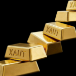 Bitunix Five gold bars labeled “XAUT” are stacked diagonally against a black background. The Bitunix logo appears in the lower right corner.